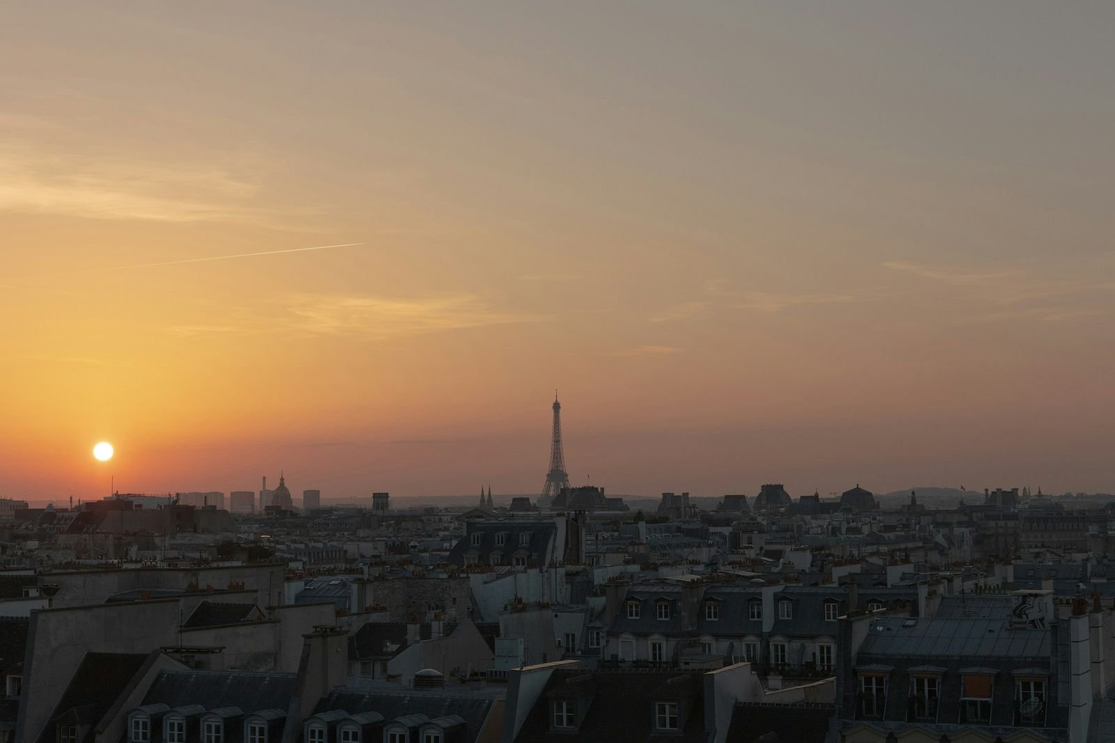 The Paris skyline at sunset with the Eiffel Tower